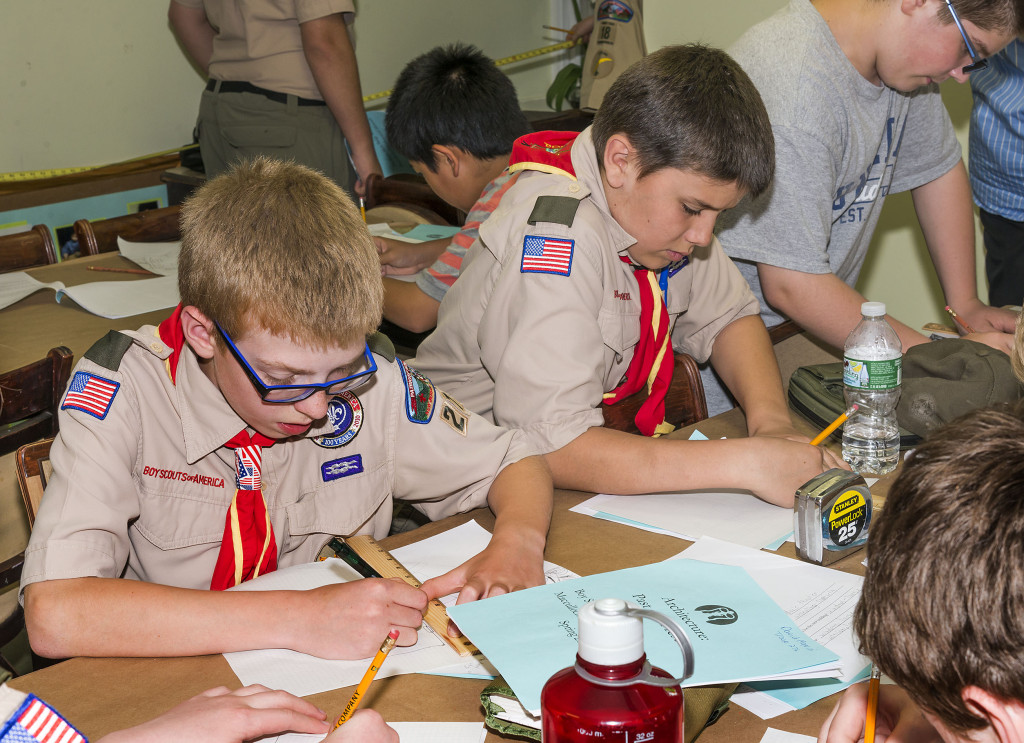 Boy Scouts working on a badge