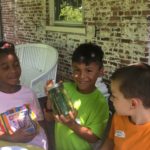 Children making refrigerator pickles in Dig it! Plant it! Eat it! summer program