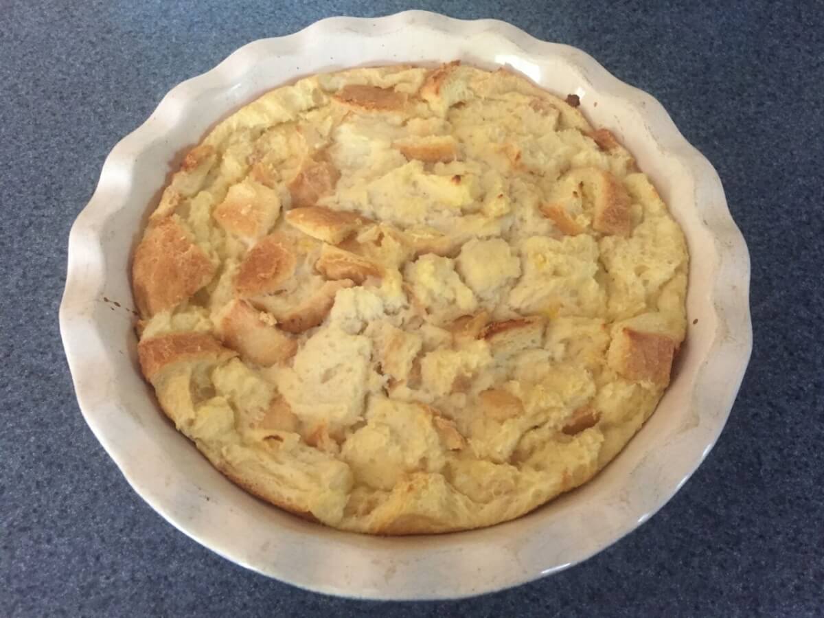 Baked bread pudding in a baking dish.