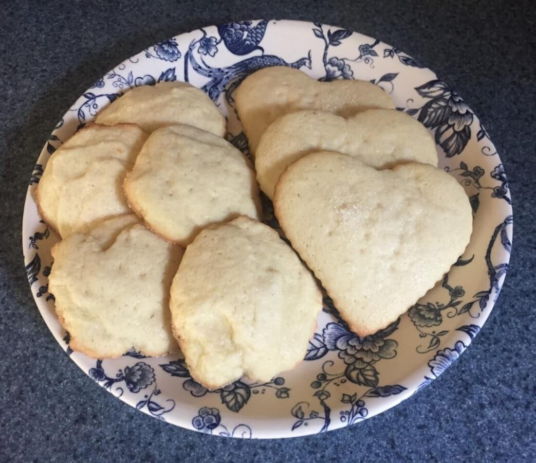 Light brown baked cookies on a plate.