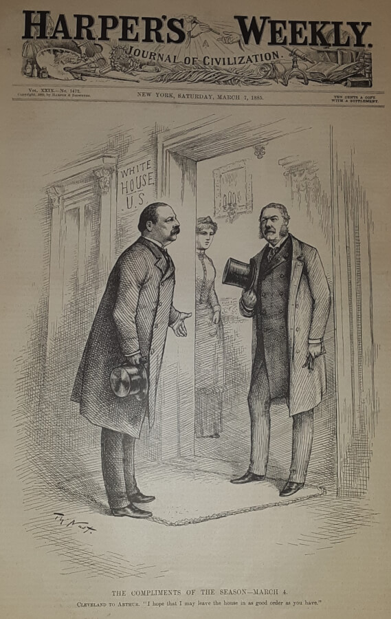 Two men stand in the doorway of the White House.
