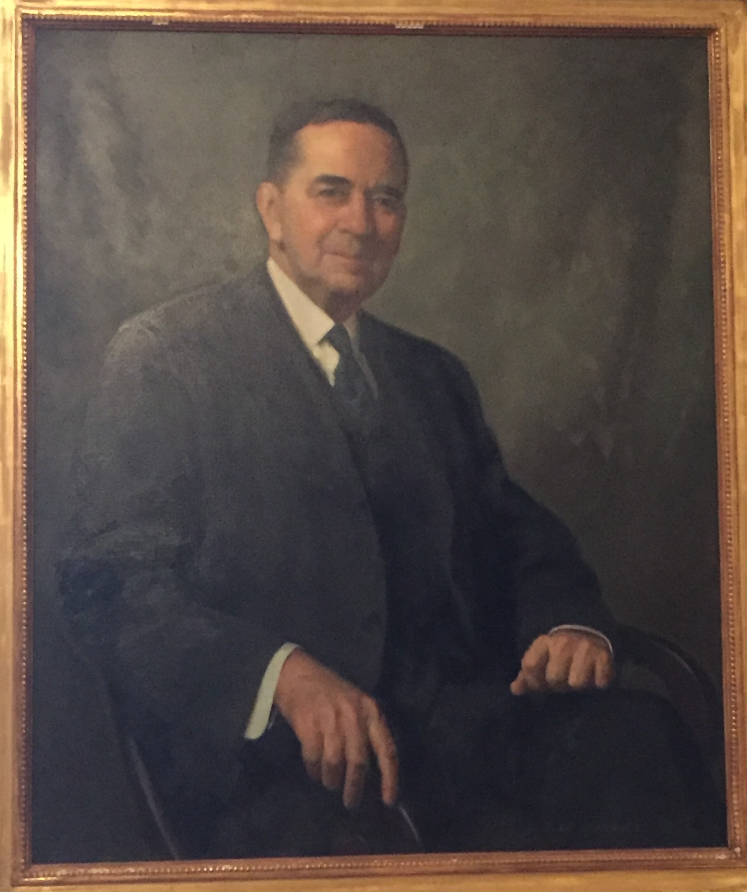 Painted portrait of W. Parsons Todd. He faces the viewer and has a slight smile. He is wearing a dark suit and tie.