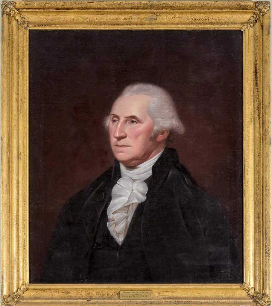 A painting of George Washington in a gold frame. A man with white hair and angular facial features looks to the left.