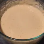 Puffs Batter Mixed batter in a large mixing bowl.