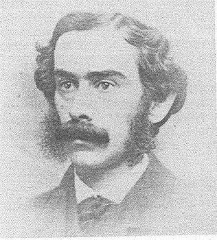 Retrato en blanco y negro de Lindley Hoffman Miller. Tiene el pelo corto y ondulado y un grueso bigote y lleva un traje.