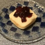 Baked square tea cake with cherry preserves on top.