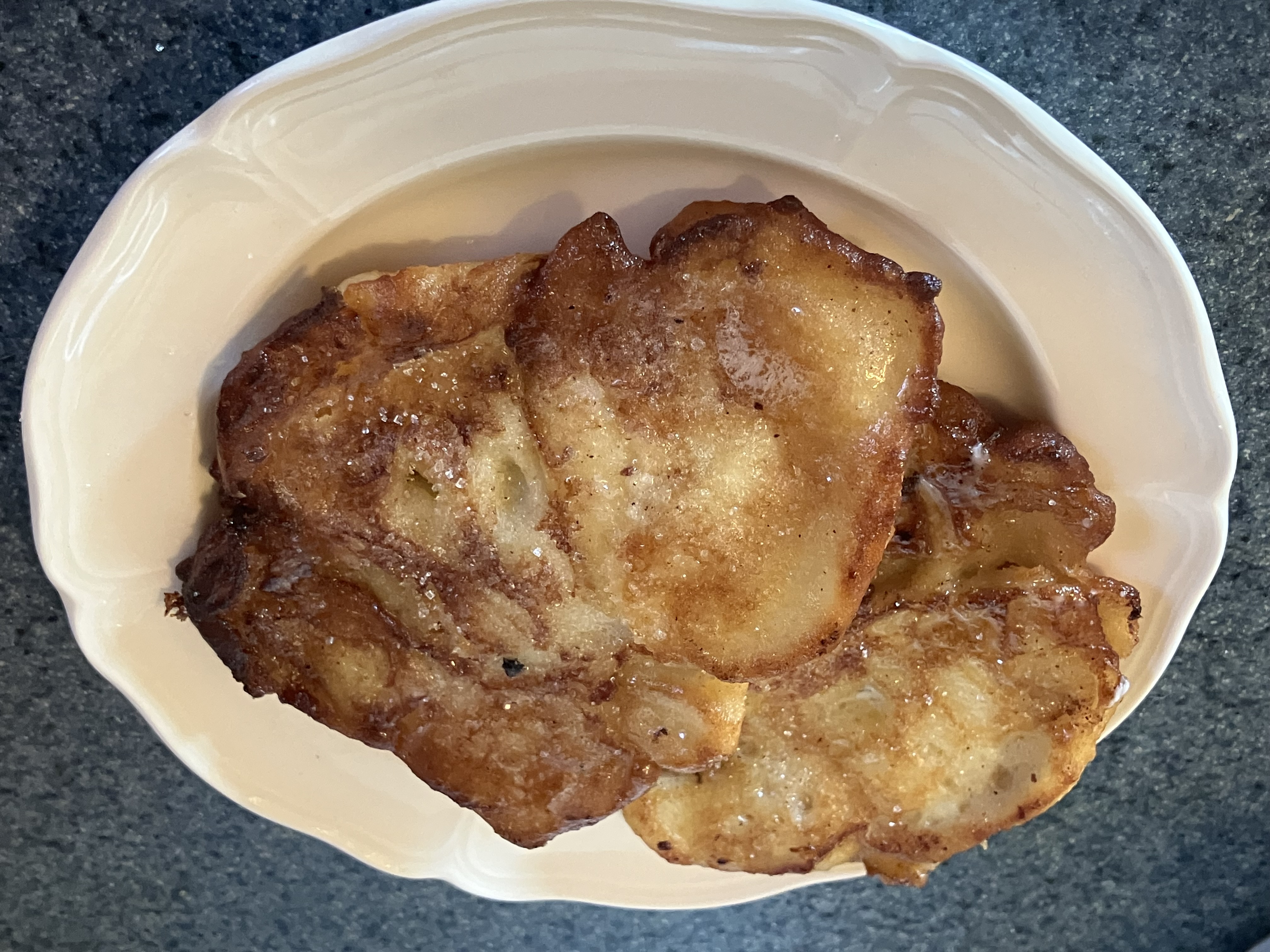 Fried bell fritters on a plate.