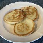 Fried bell fritters on a plate.